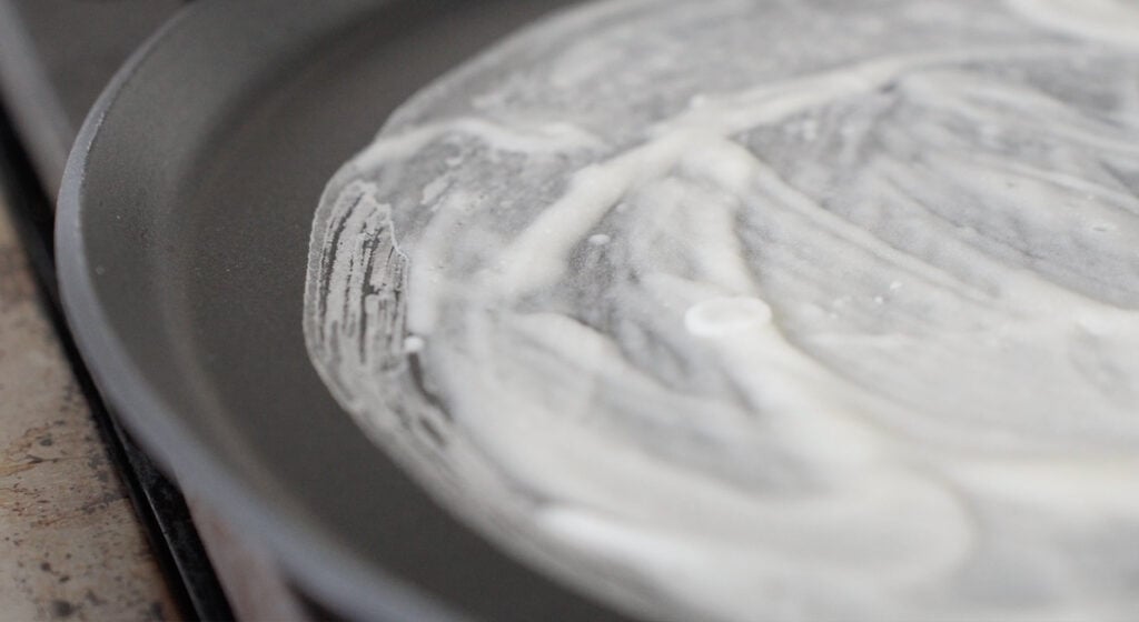 lumpia wrapper cooking on a hot non stick skillet
