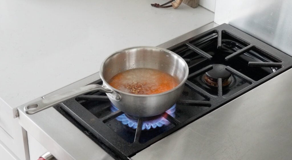 Sweet Chili sauce ingredients in a pot on a stove