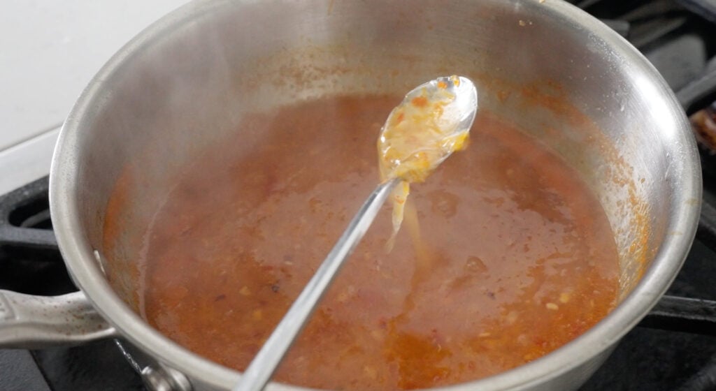 thickened sweet chili sauce on a spoon