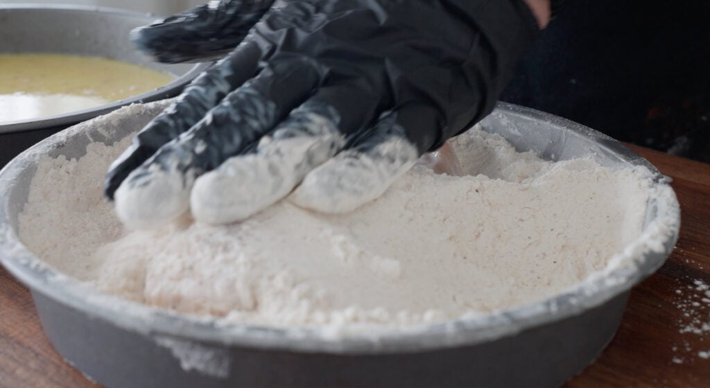 dredging chicken in flour