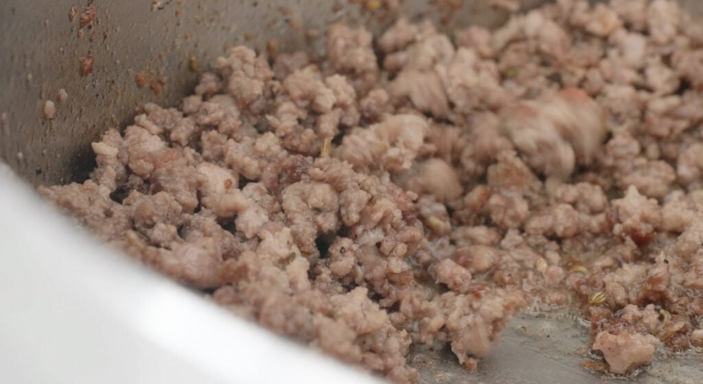 browning the italian sausage and ground beef in large pot