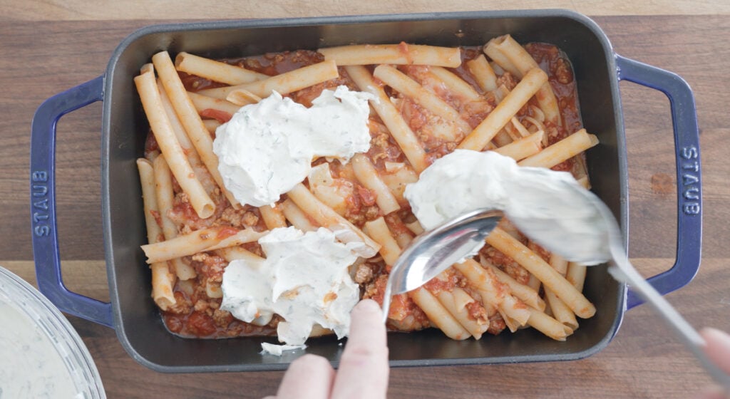 baked ziti assembled in baking dish