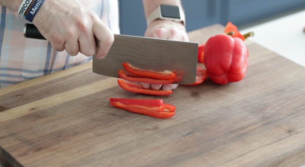 Prepare all vegetables slicing bell peppers