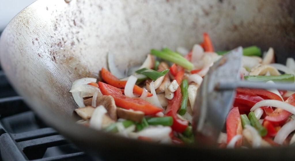 Cook the vegetables in wok