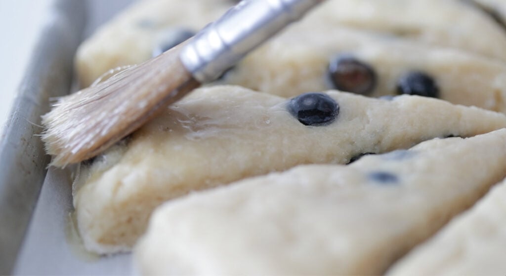 brush the scone tops with melted butter