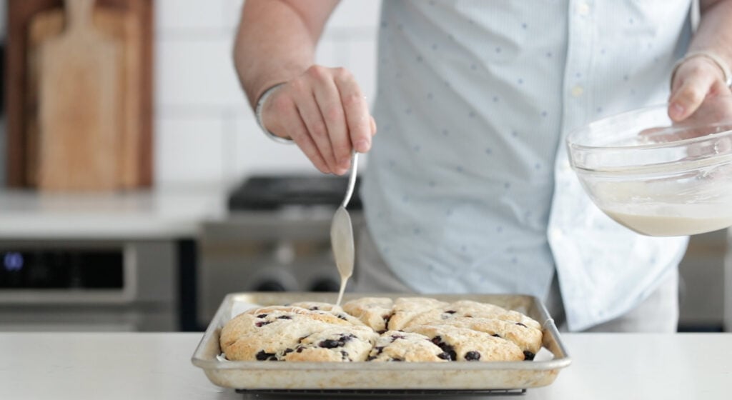 place them on a rack to cool to room temperature, then drizzle the glaze over the top