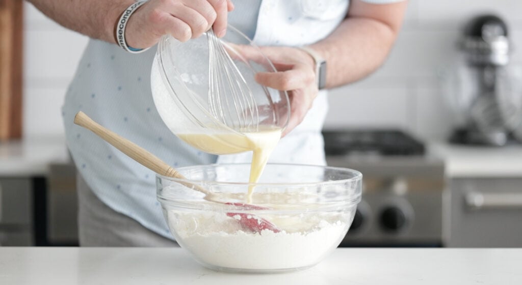 pour the wet ingredients into the bowl with the dry mixture