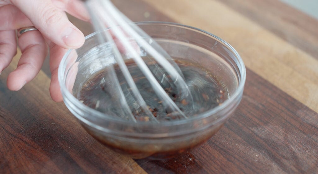 Whisking together sauce ingredients