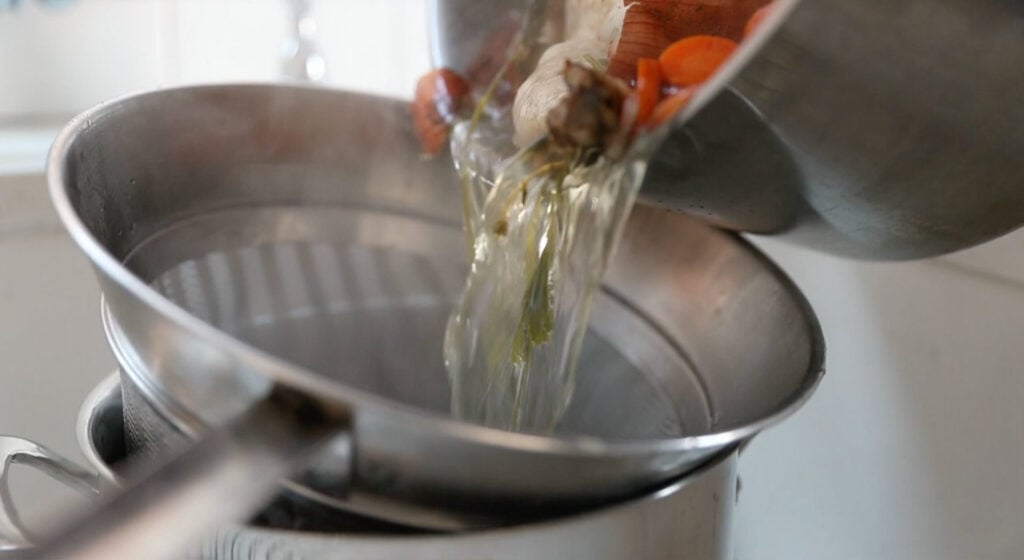 straining the chicken liquid