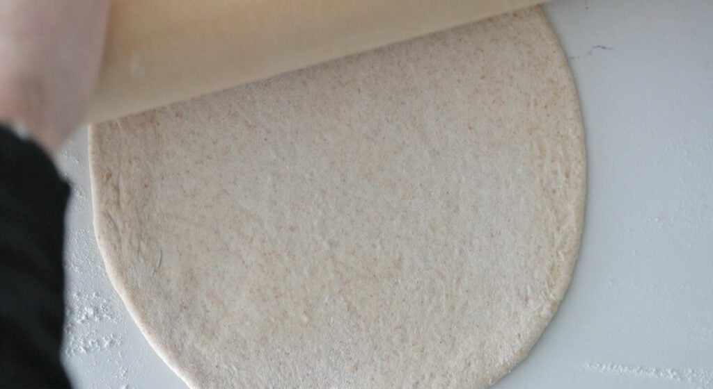 rolling dough ball into a circle