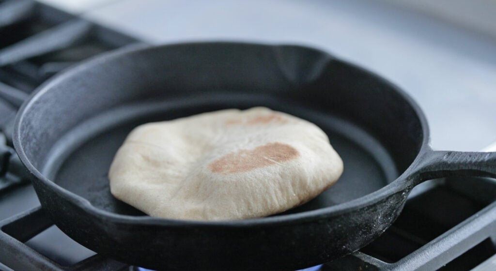 pita bread on hot skillet cooking