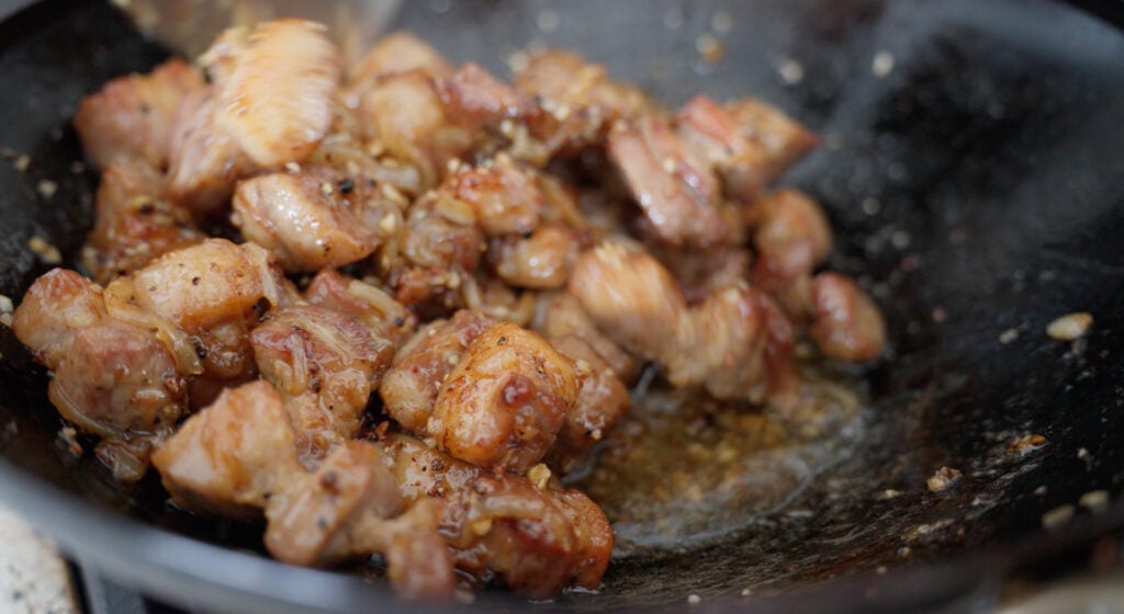 Browned pork and onions in wok