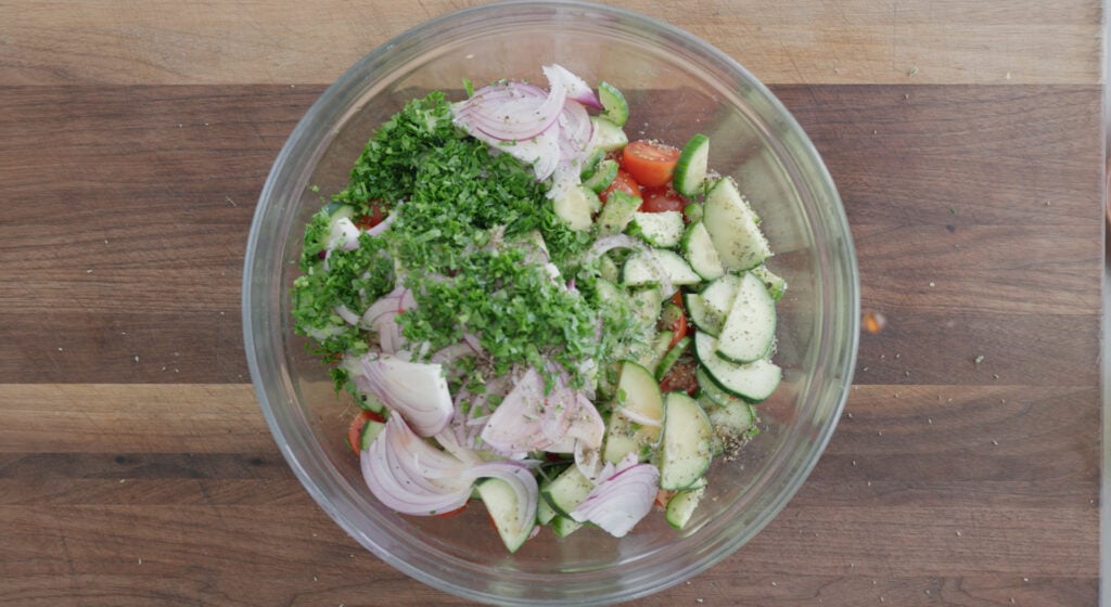 cucumber tomato salad ingredients in a bowl