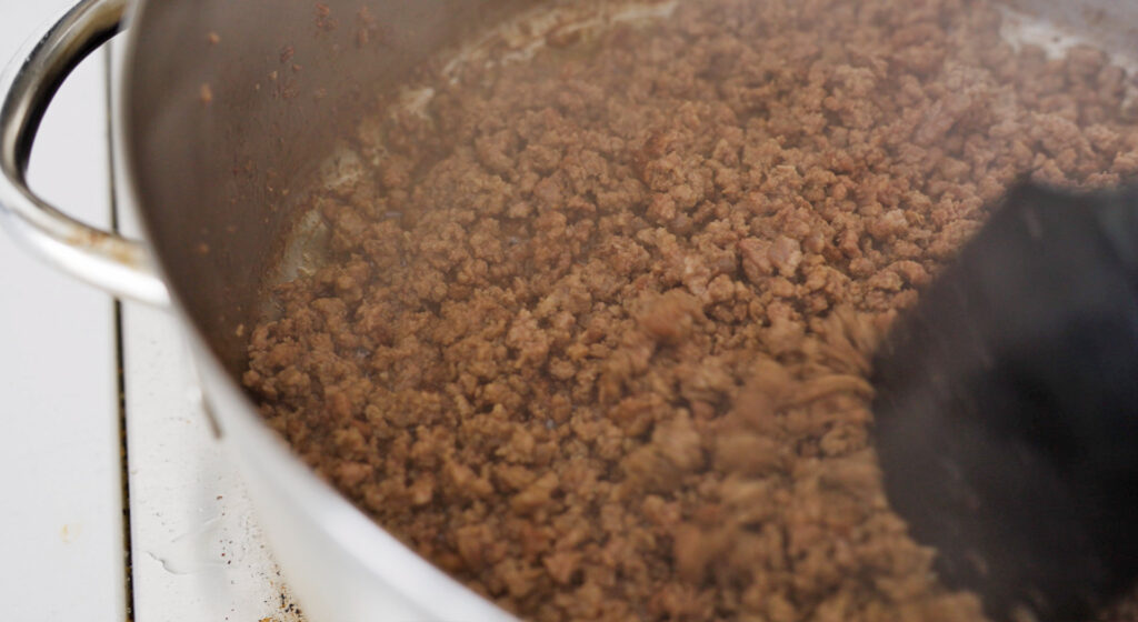 searing ground beef in large pan