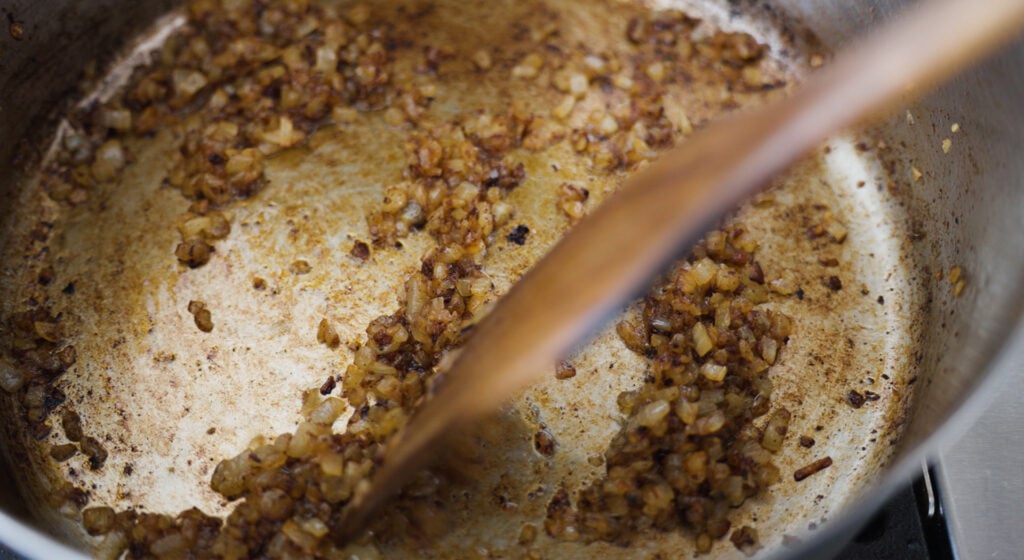sauteeing onions in pan