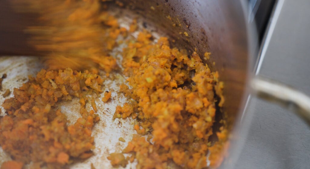vegetables cooking in large pan