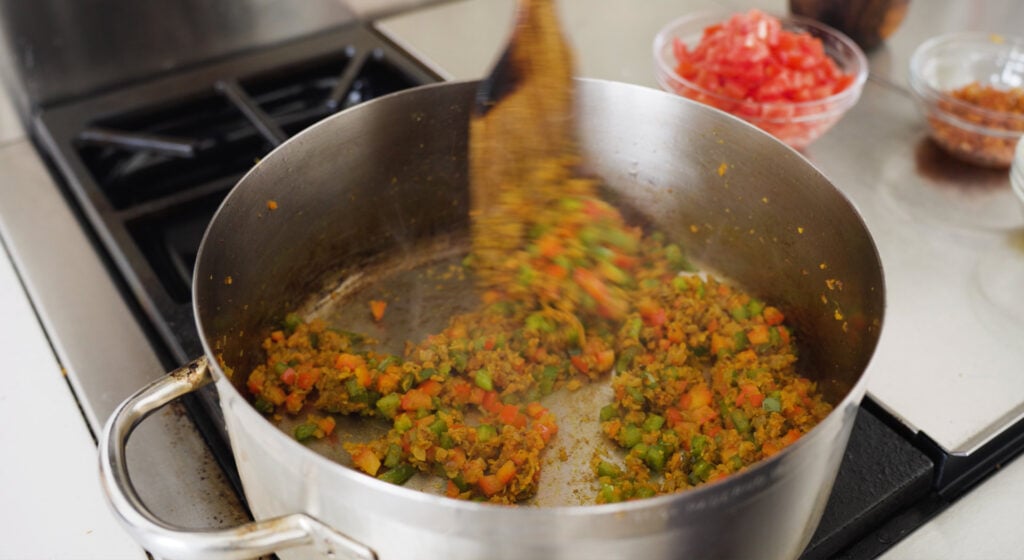 stiring vegetables in pot