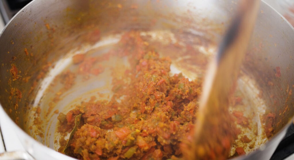 stirring ingredients in pot together 