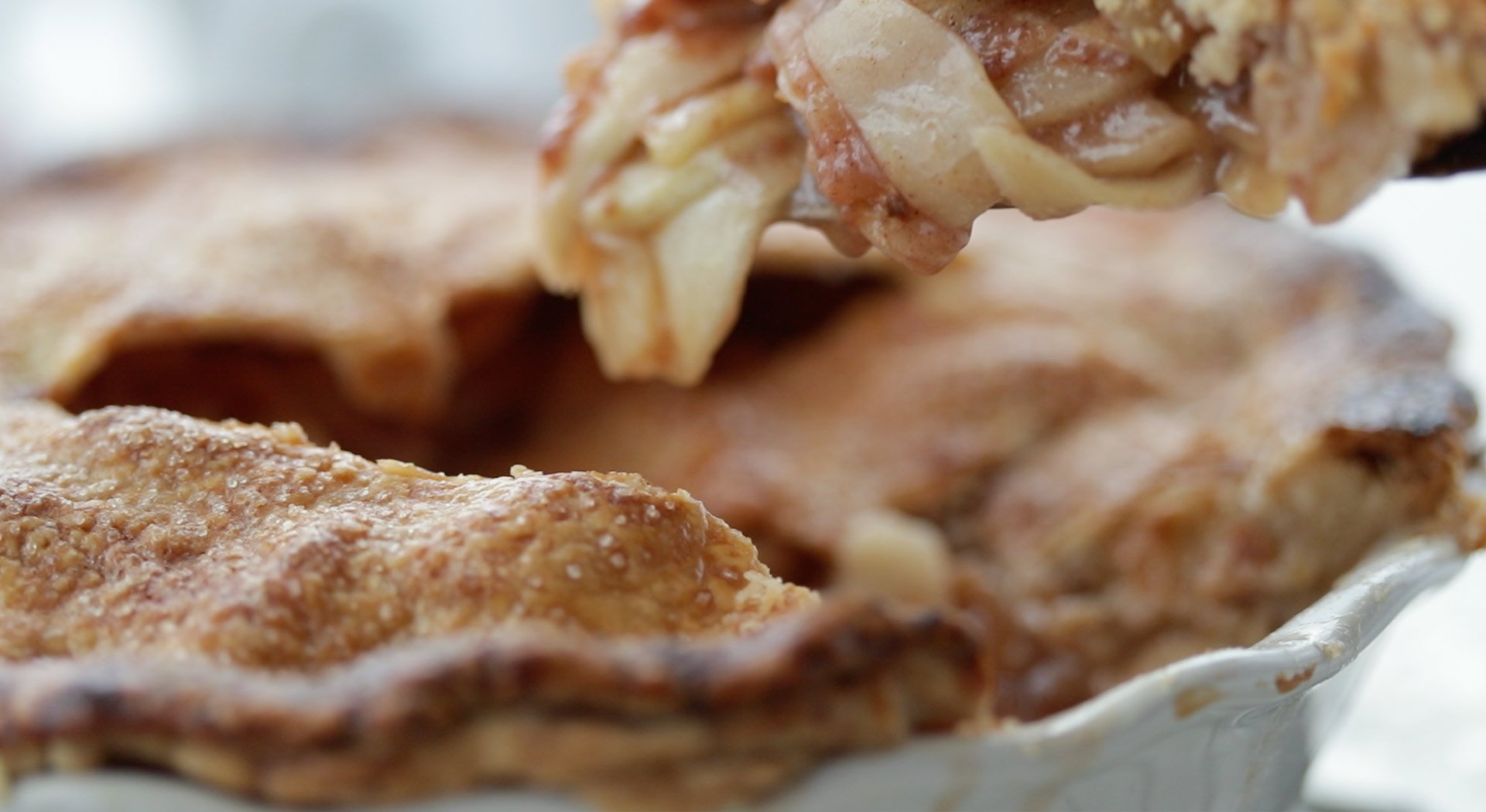 apple pie with slices taken out