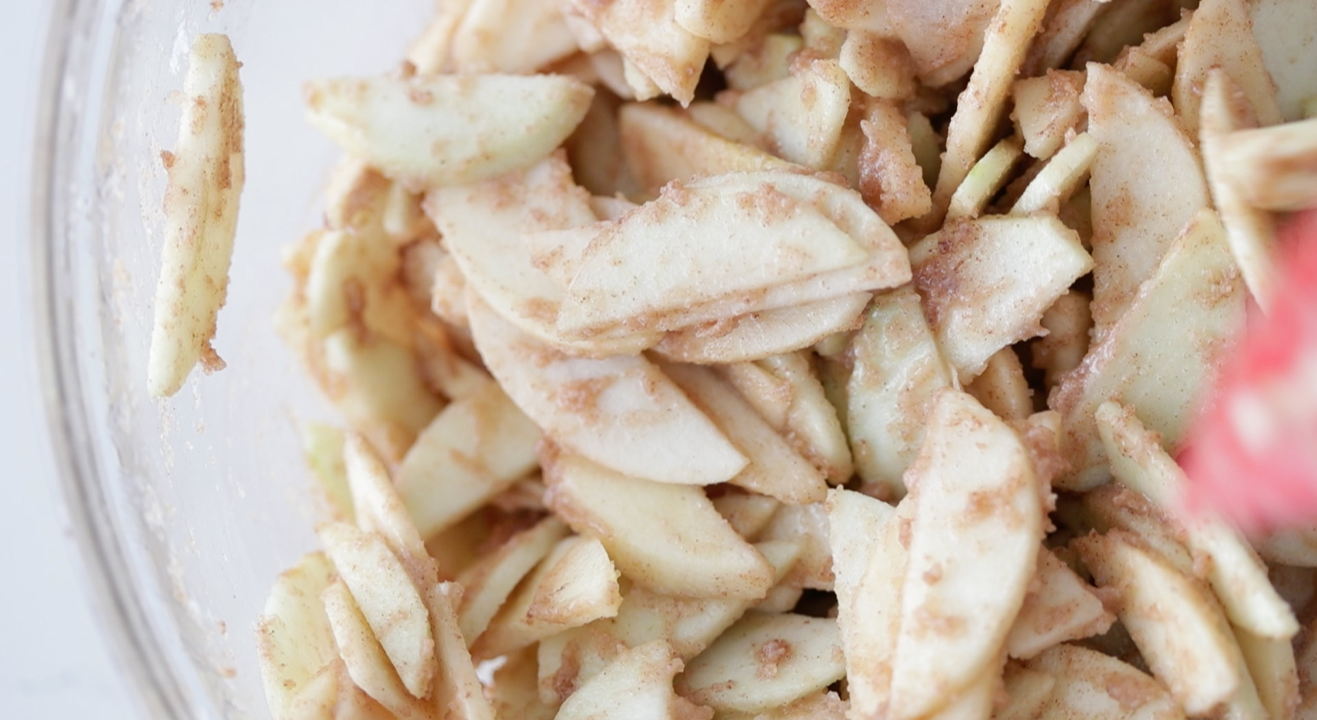 mixing apples with spices