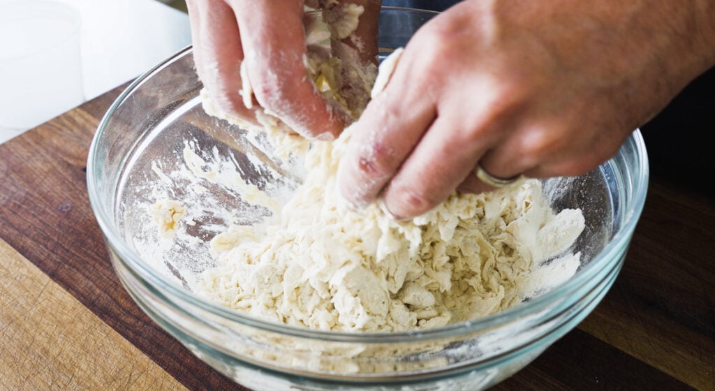 Mixing ingredients in bowl by hand