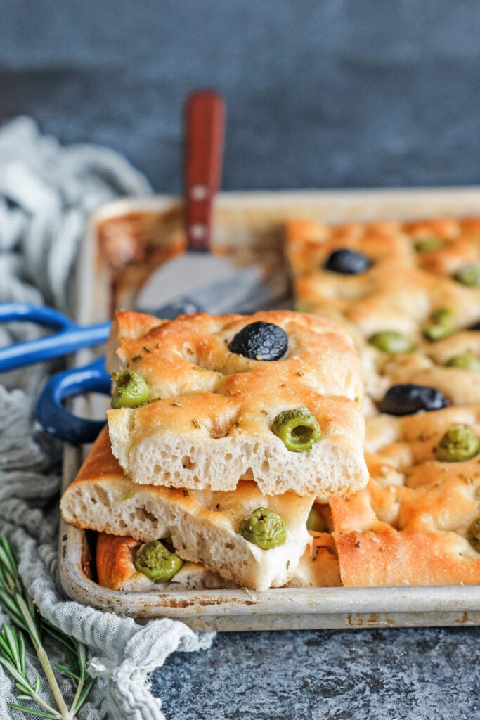 Olive Focaccia sliced on a pan