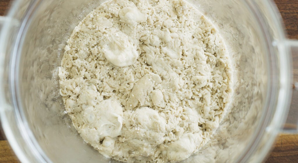 Dough fermenting in plastic container