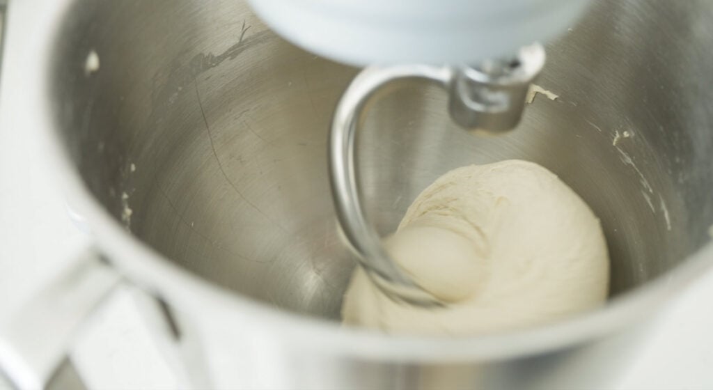 dough on hook in mixer