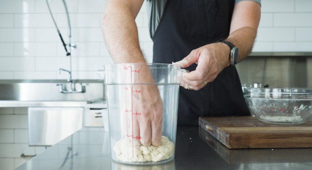mixing biga ingredients in large container