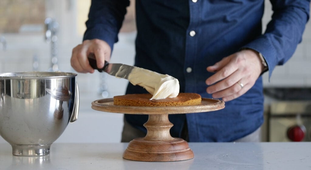 one cake layer and spread of frosting