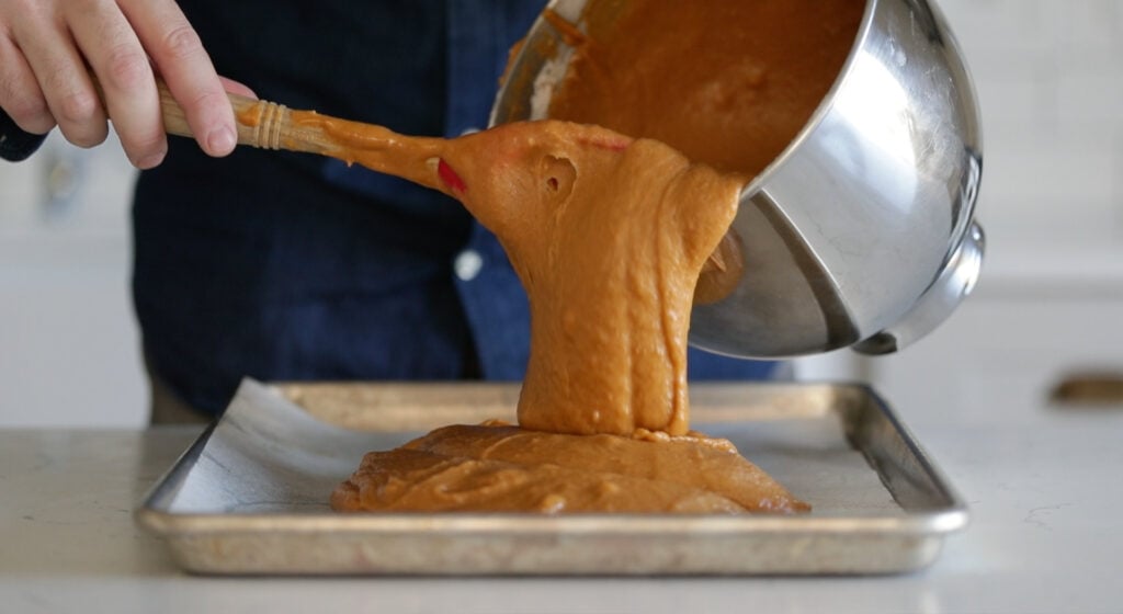 pour batter into cookie sheet tray
