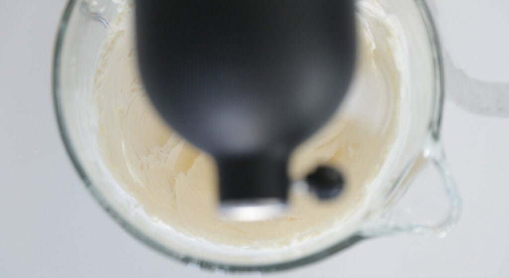 whipping butter and cream cheese in a stand mixer