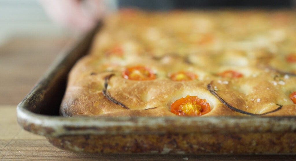 Golden brown tomato focaccia in pan