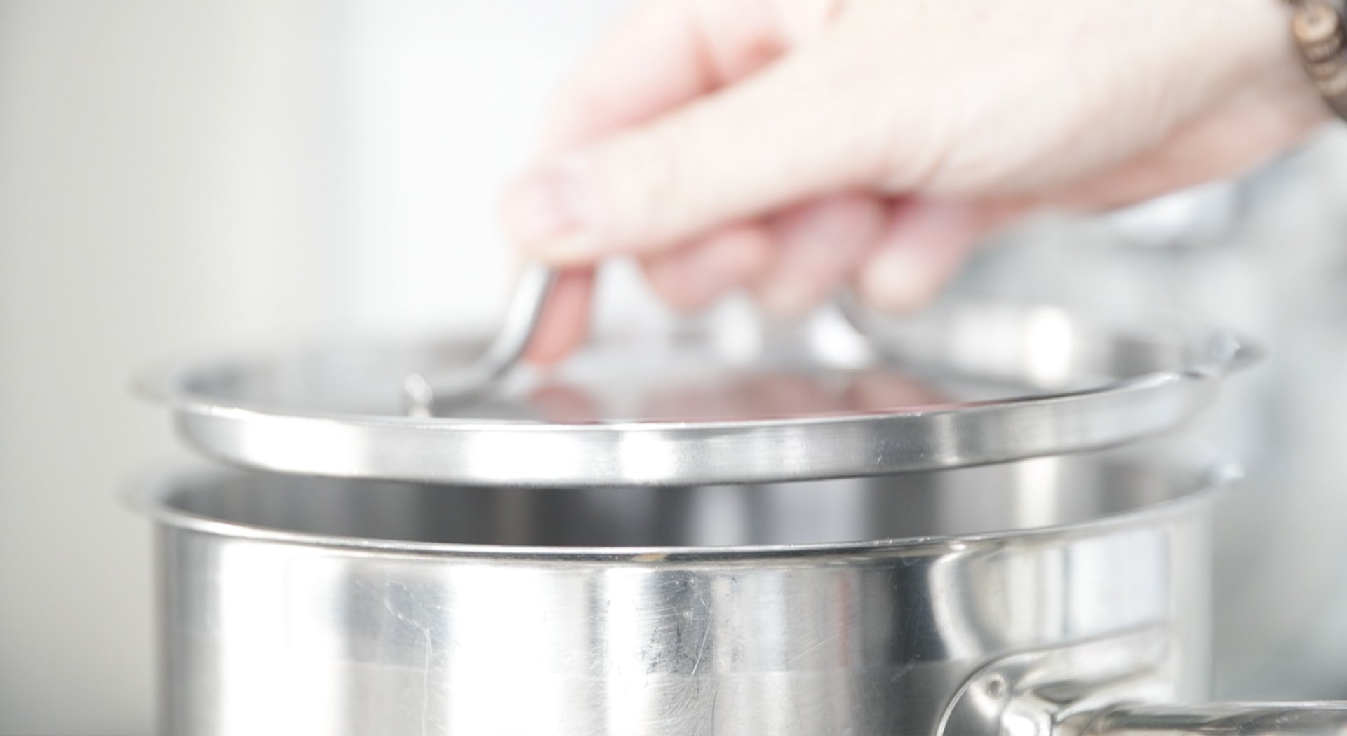 adding a lid to a pot