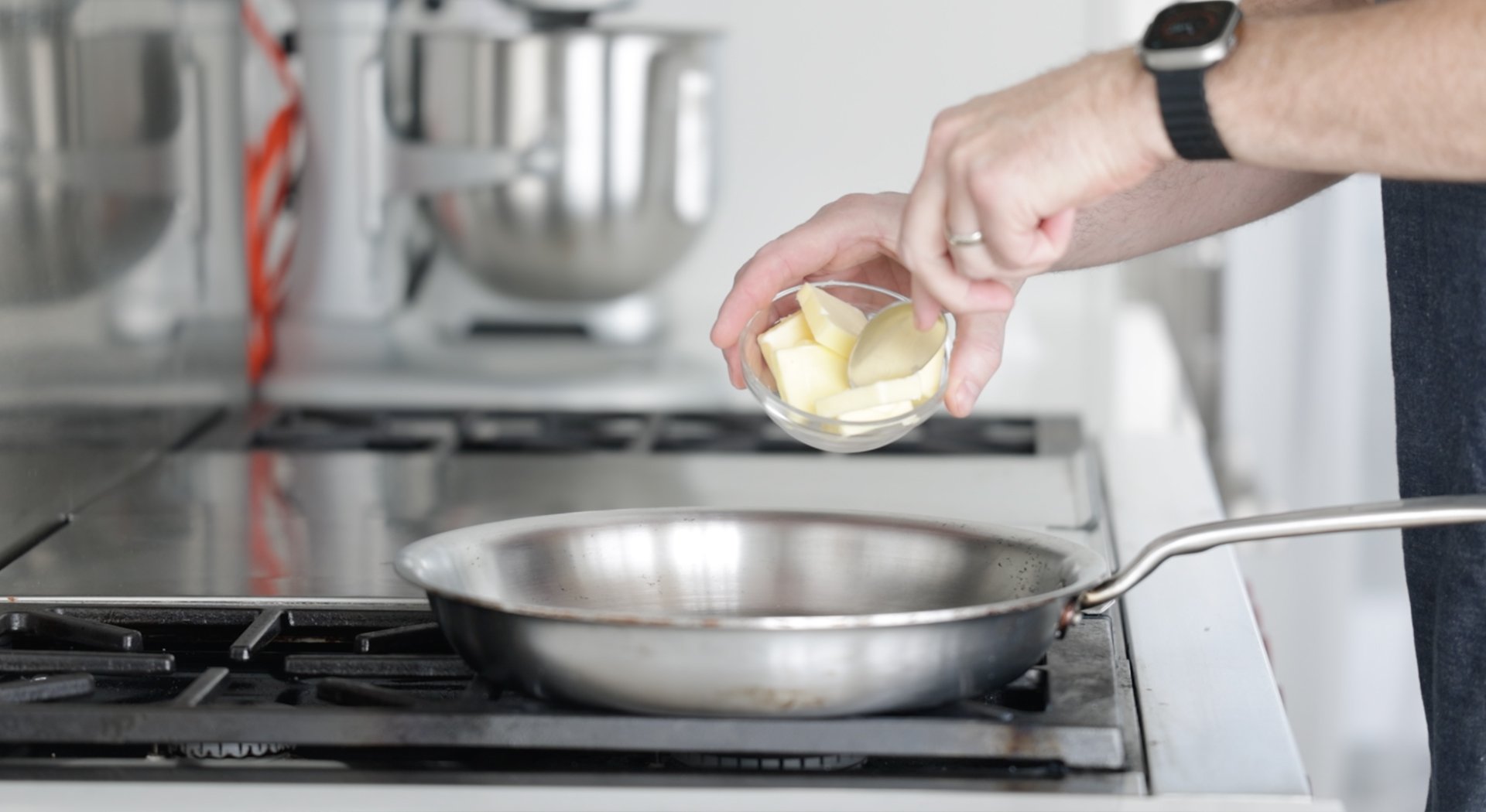 adding butter to a pan