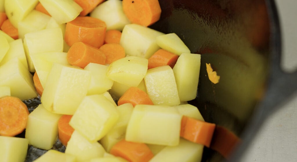potatoes and carrots in a pot