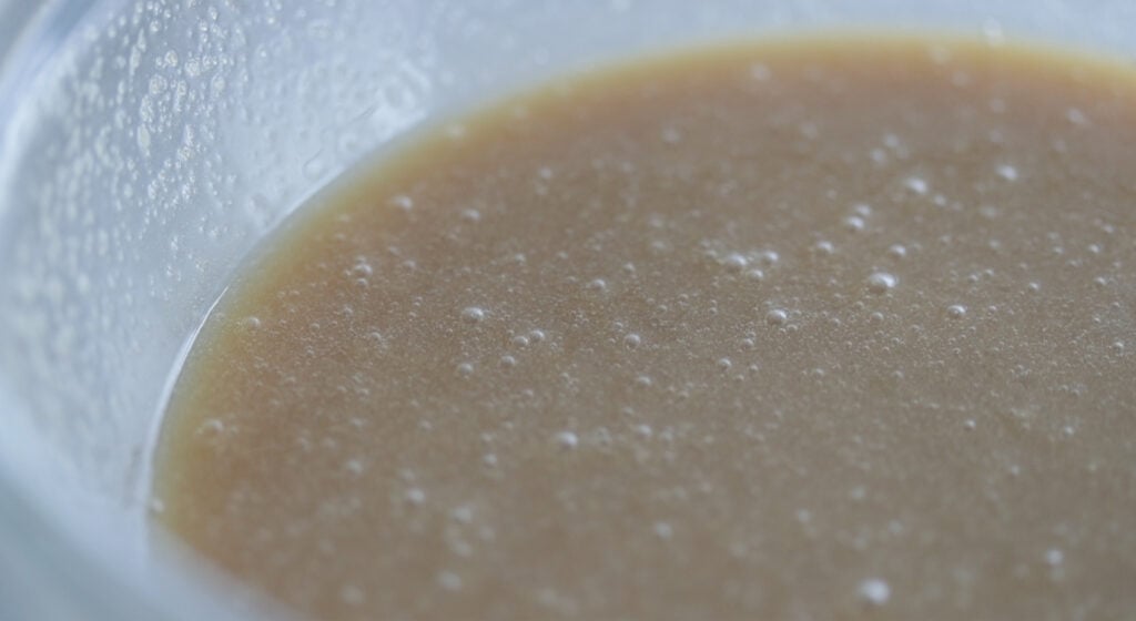 whisking together corn syrup and eggs