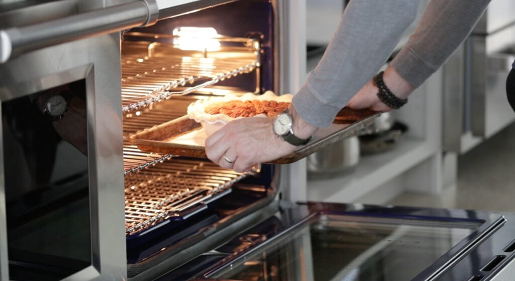 placing a pie in the oven