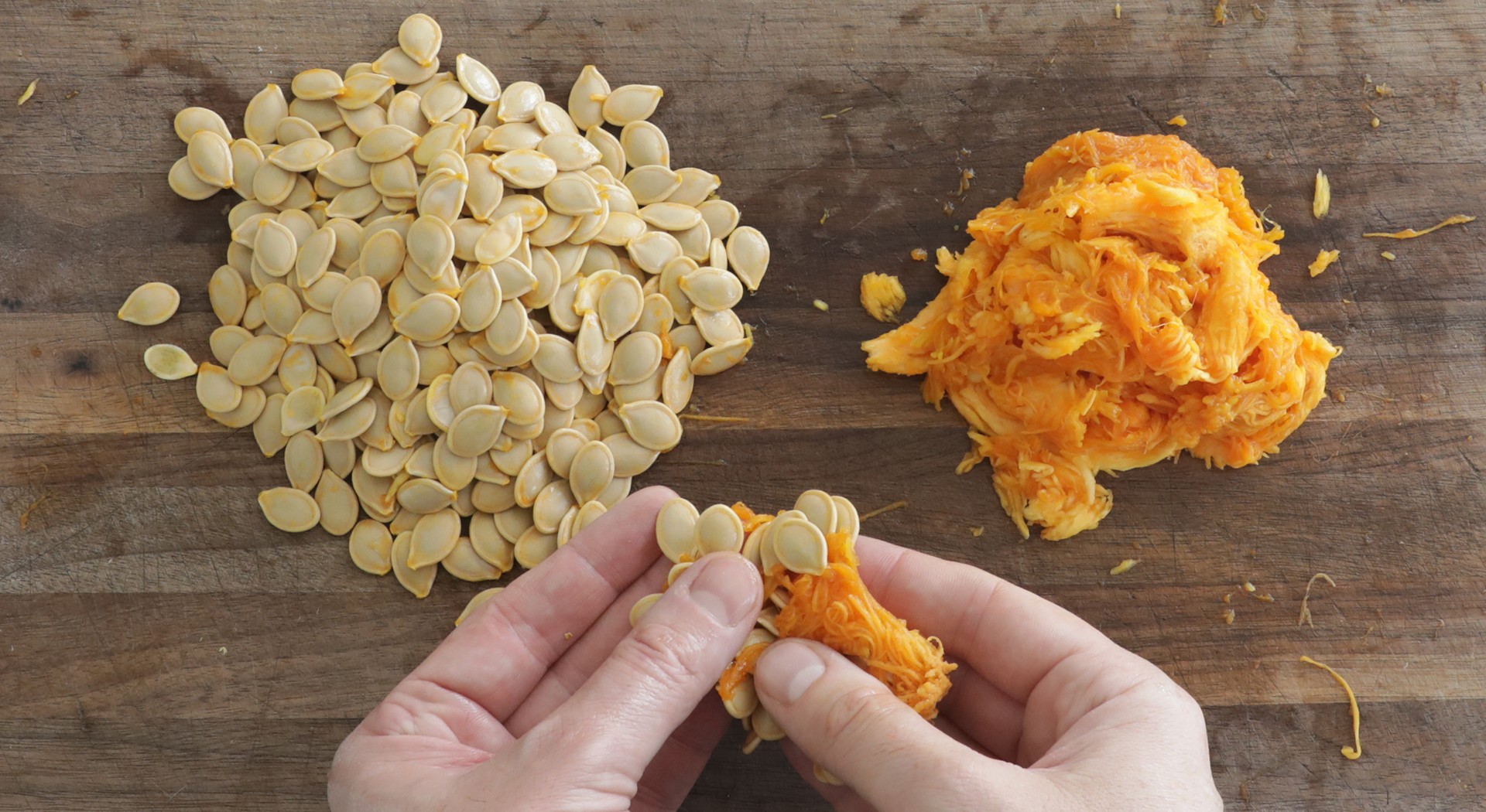 picking pumpkin seeds