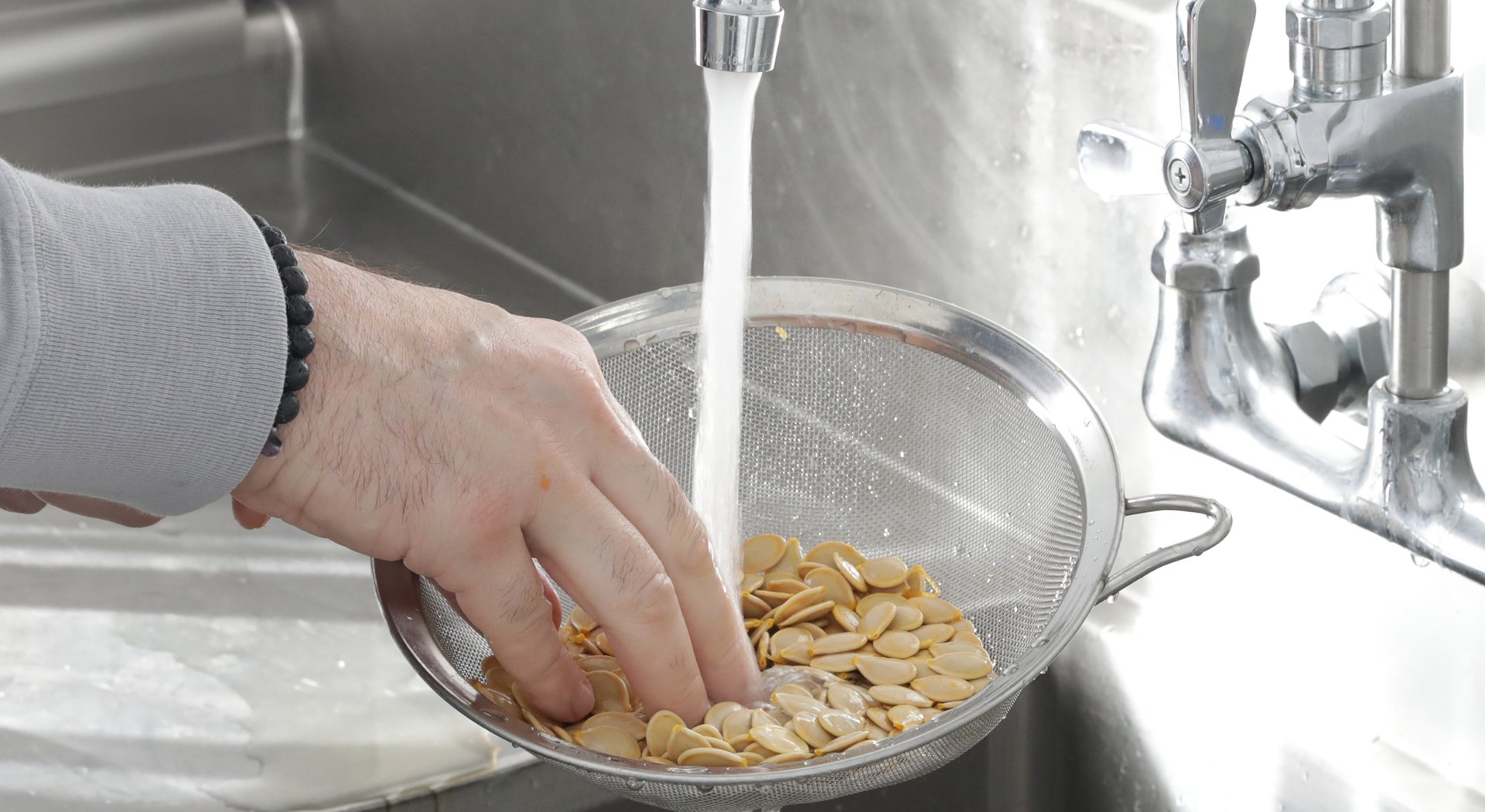 rinsing the pumpkin seeds