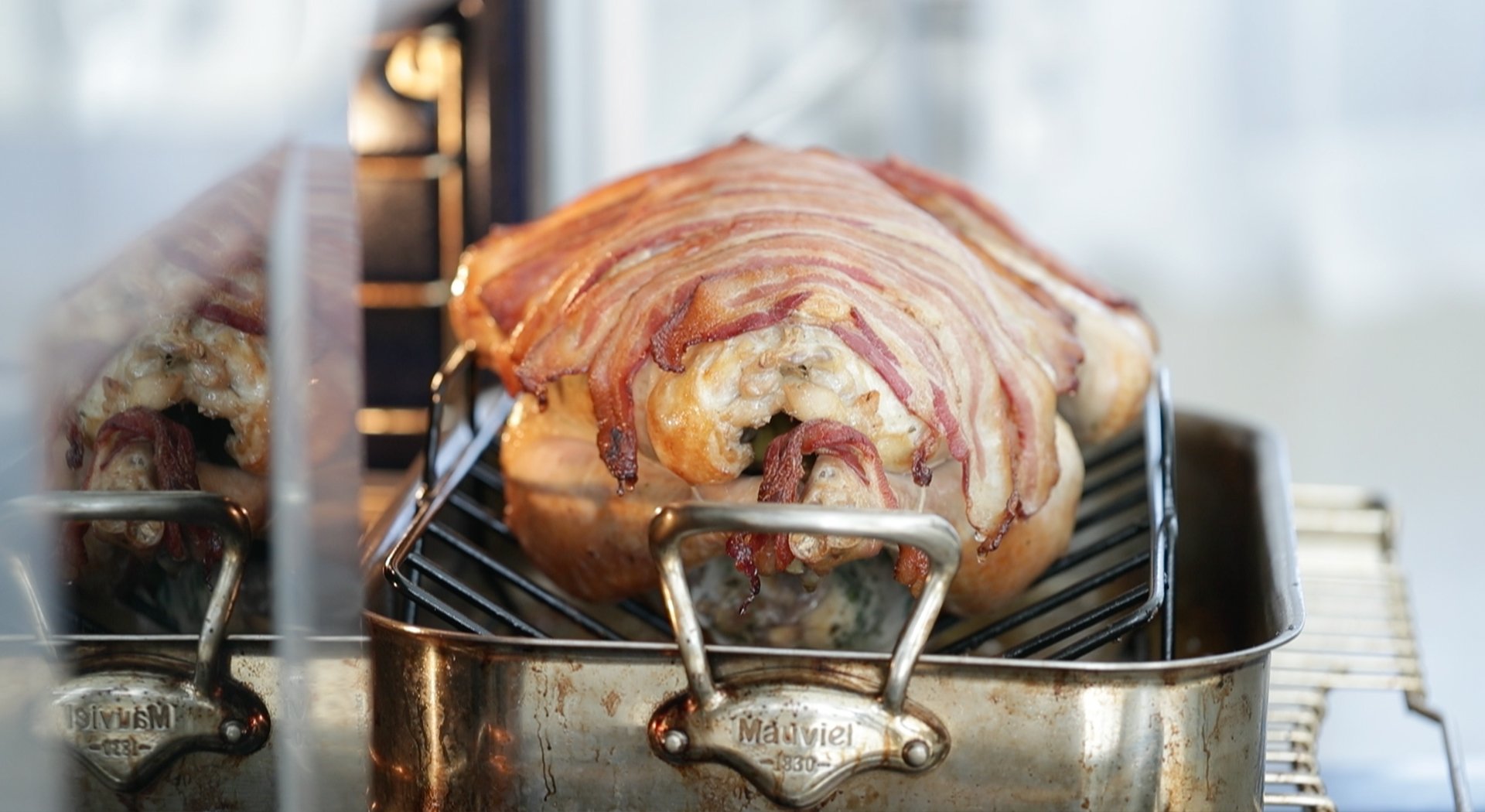 a cooked turkey with crisp bacon
