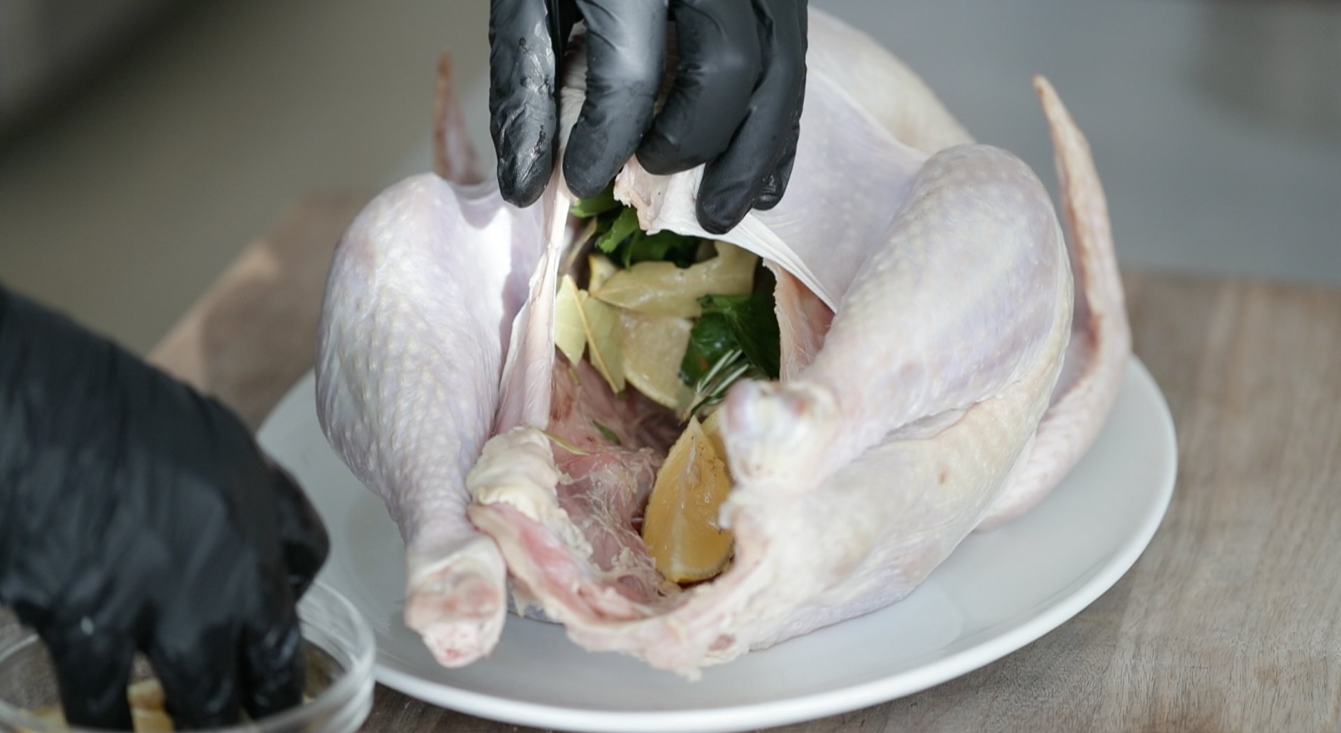 stuffing a turkey with lemons and herbs