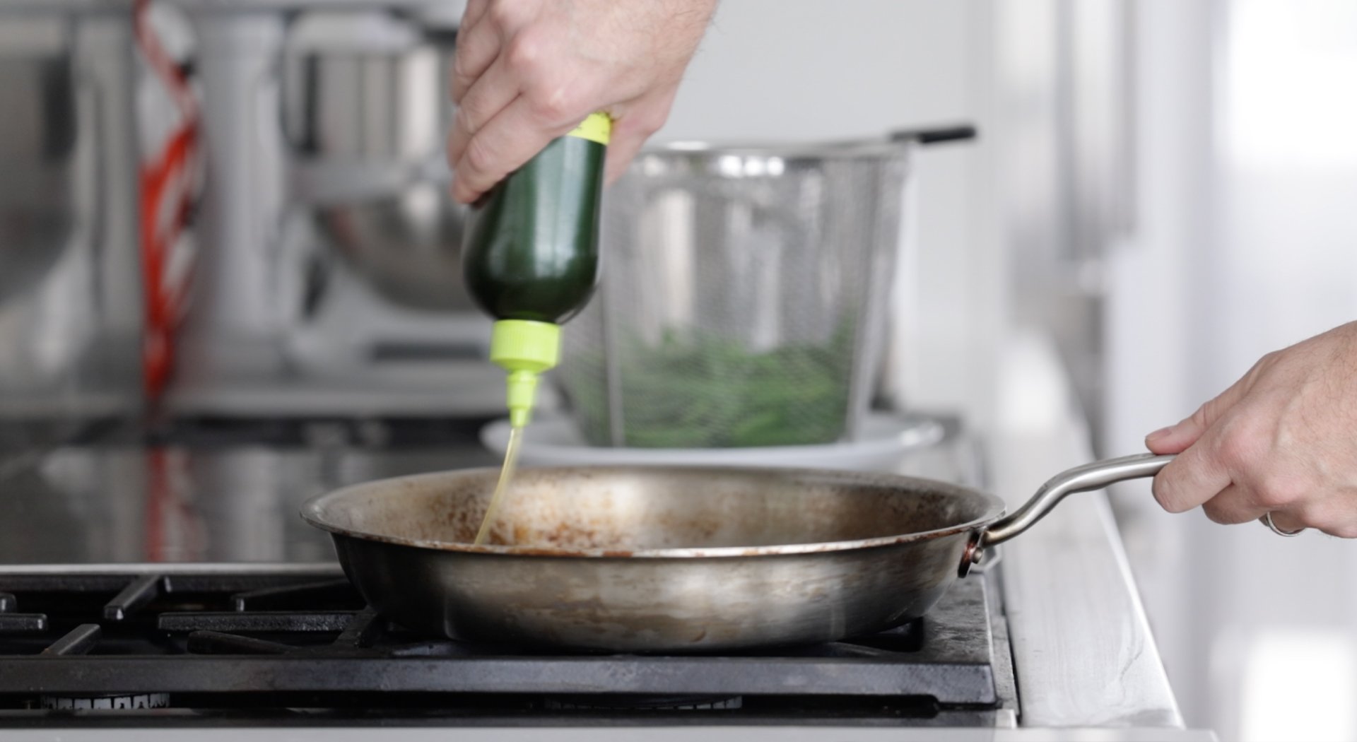adding oil to a pan