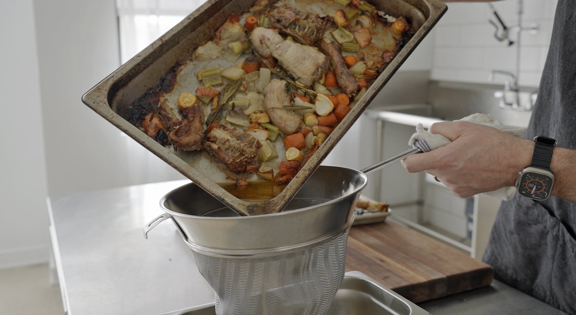roasting turkey parts and veggies in a pan