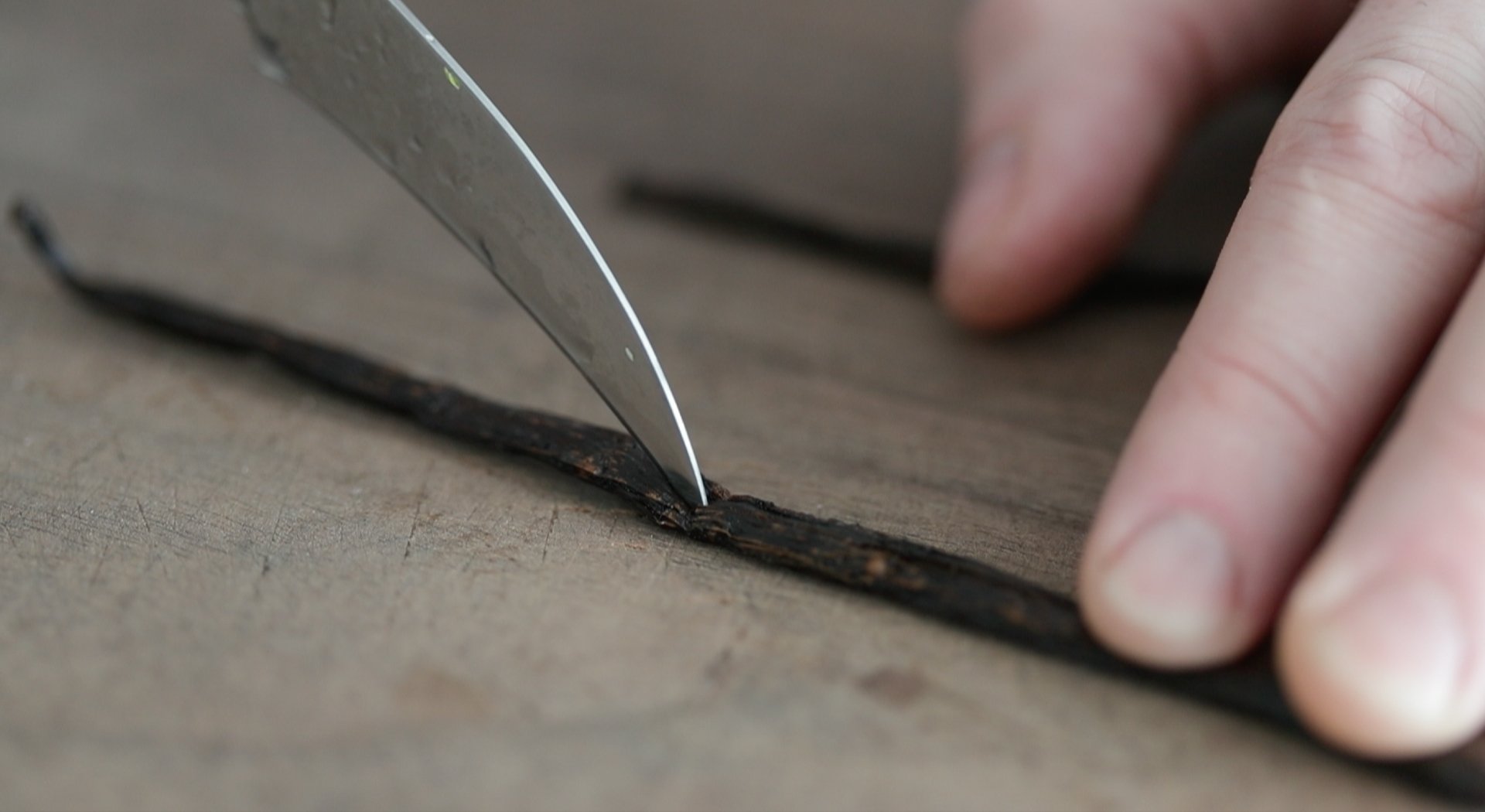 slicing a vanilla bean