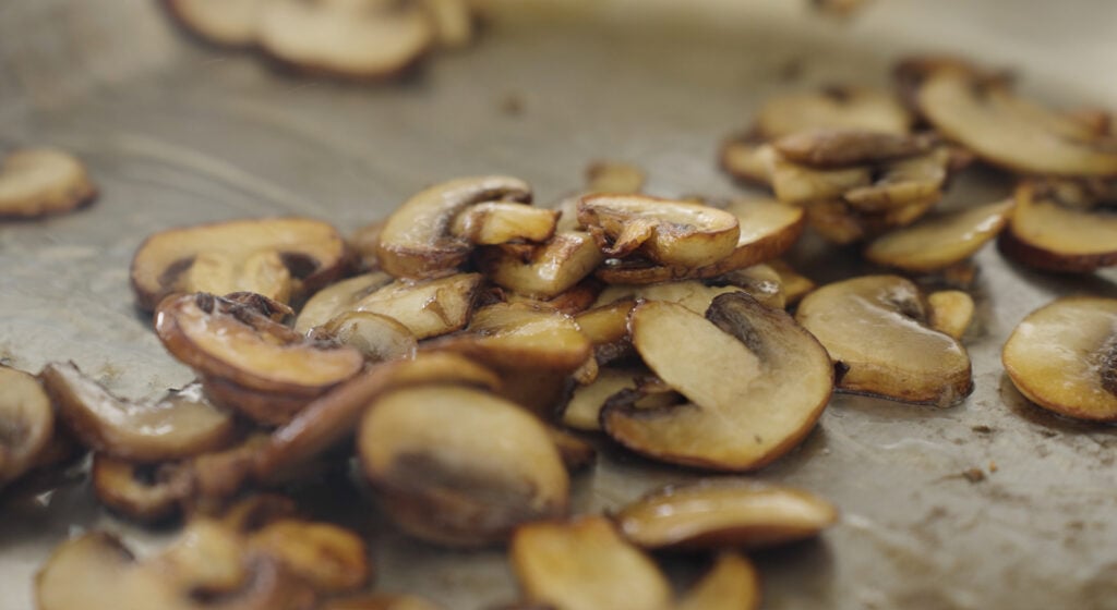 close up of browned mushrooms in a pot
