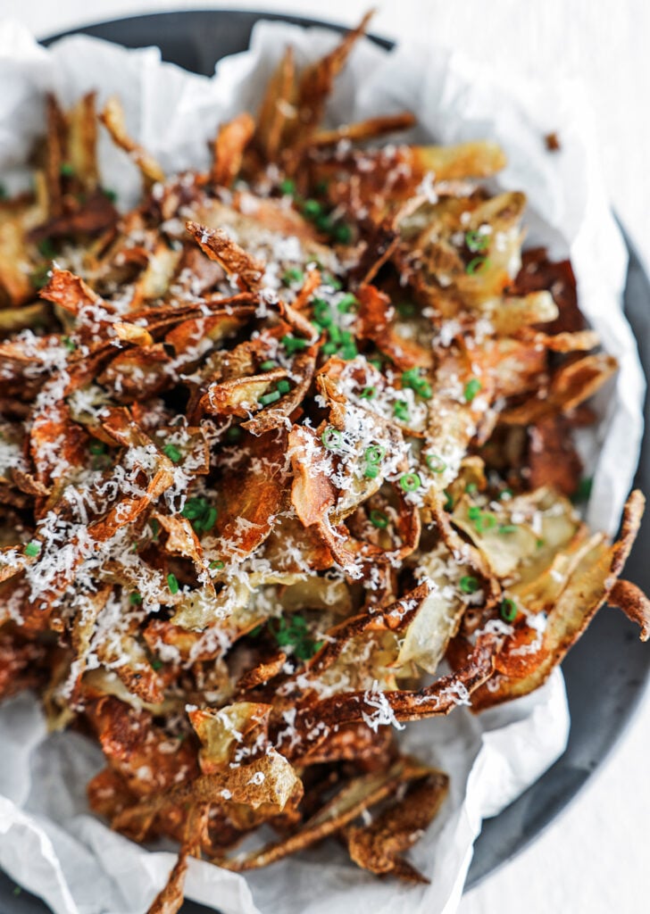 crispy potato skins on a serving plate