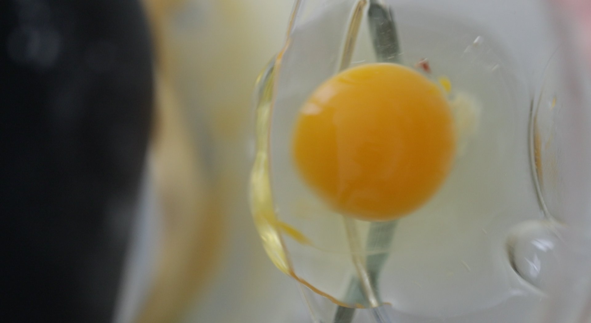 adding an egg to a stand mixer