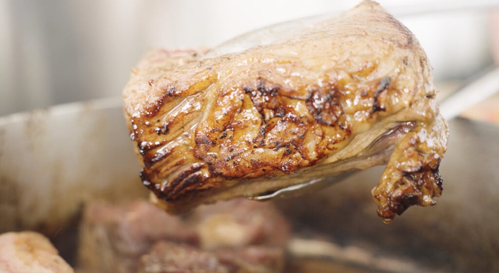 Close up of a piece of beef that has been seared on one side