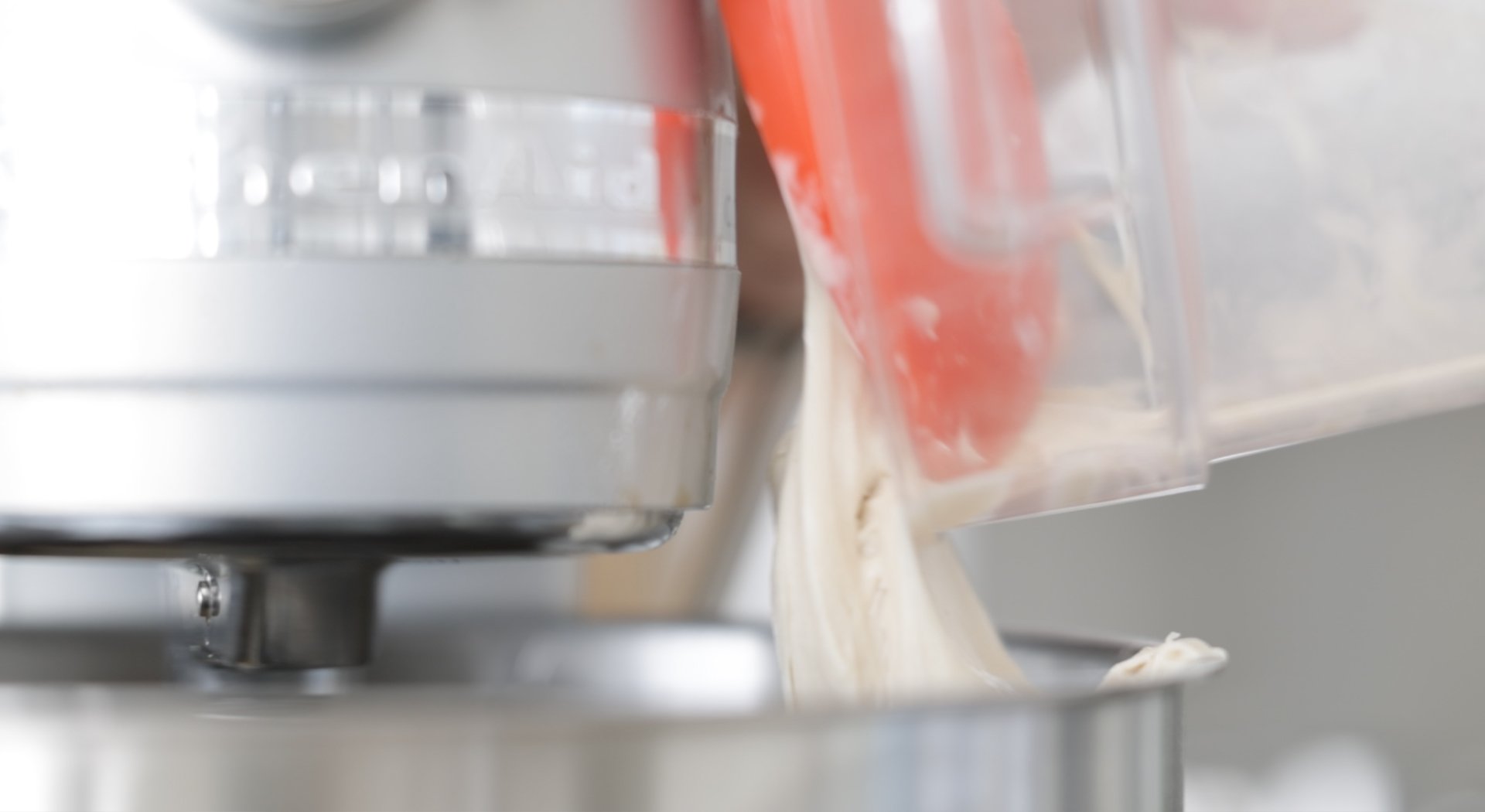 adding a biga dough to a mixer